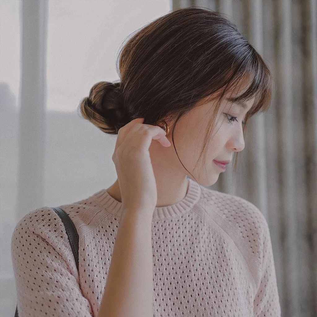 Messy Chignon with Wispy Bangs