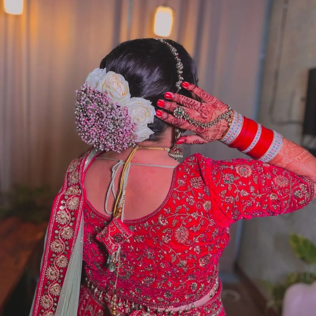 Bridal Bun with Bangs and Flowers